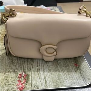 Coach Cream Shoulder Bag with Gold Hardware and Flap Closure